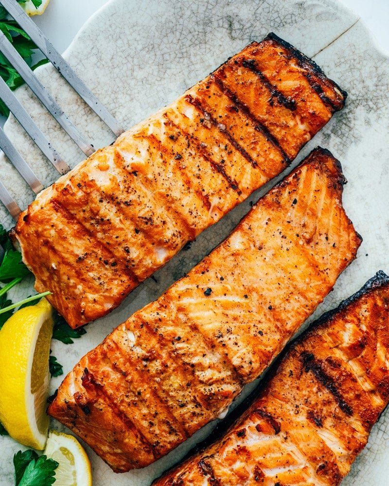 Grilled Salmon on platter with lemon.